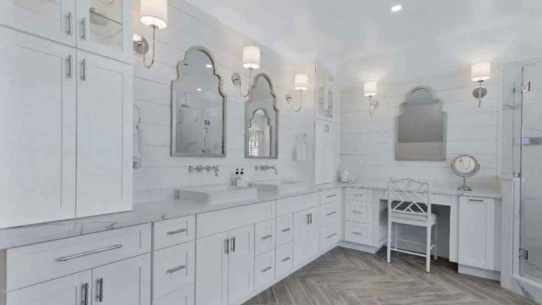 A tiled walk-in glass shower with a grey vanity in a Seacoast New Hampshire bathroom by Benchmark